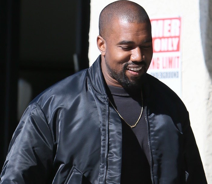 Kanye West looking happy taking his daughter to ballet class