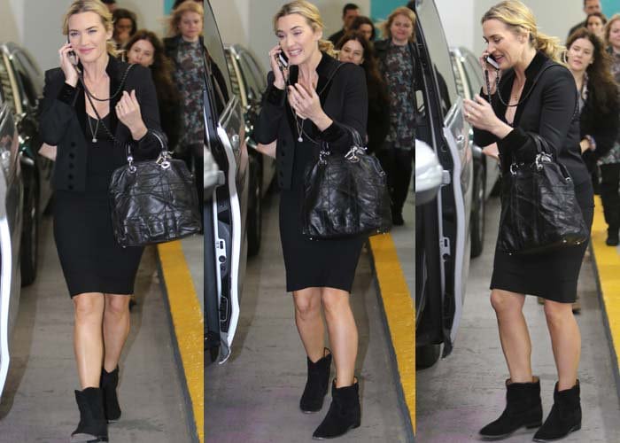 Kate Winslet talks on the phone as she leaves her "This Morning" interview at ITV Studios