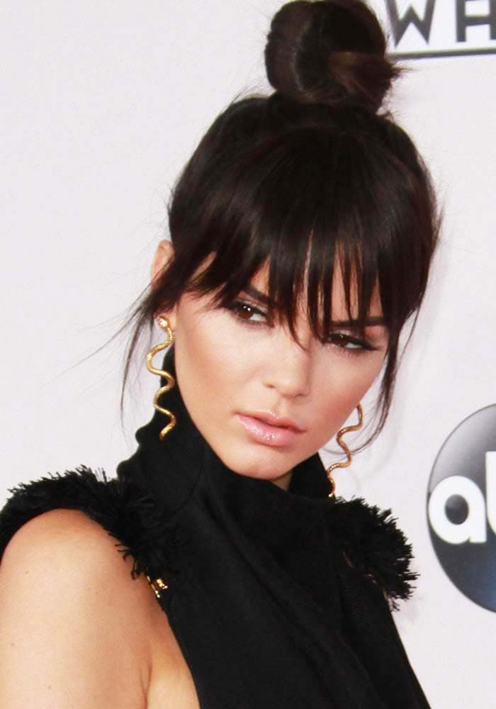 Kendall Jenner debuts her newly-cut hair as she arrives at the American Music Awards