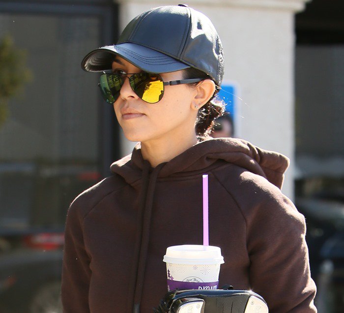 Kourtney Kardashian wears matte black metal and acetate Concorde 2 sunglasses by Westward Leaning