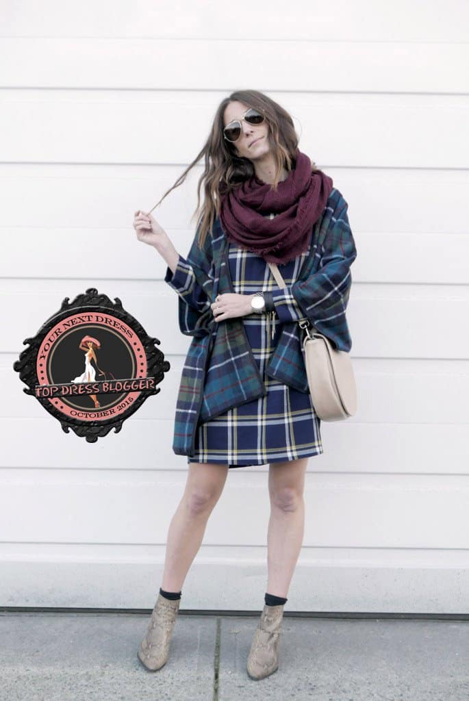 Kiara works a plaid-on-plaid look with snakeskin ankle boots