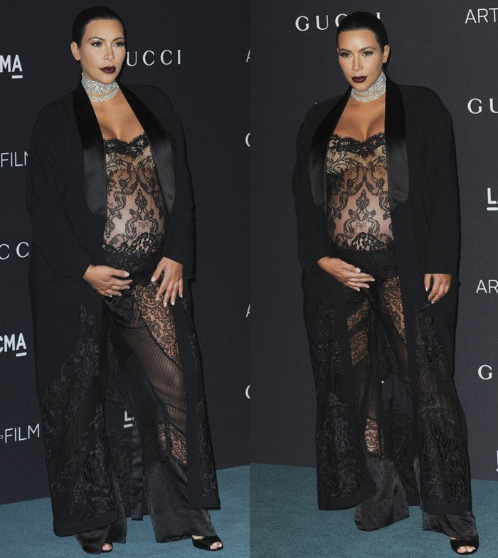 Kim Kardashian styled her sheer black lace jumpsuit with a flowing satin blazer, bold Givenchy sandals, and a sparkling diamond choker for a glamorous red-carpet look