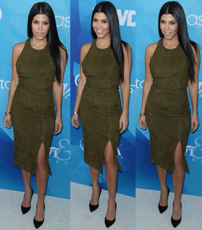 Kourtney Kardashian wears an olive green set from Alice + Olivia on the blue carpet