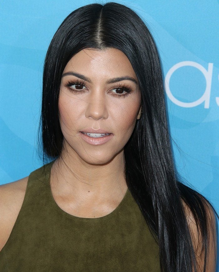 Kourtney Kardashian wears an olive green Alice + Olivia top at a WWD and Variety event