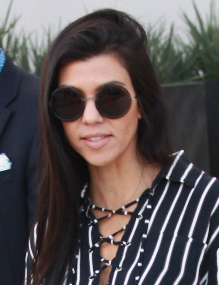 Kourtney Kardashian wore her long dark tresses down
