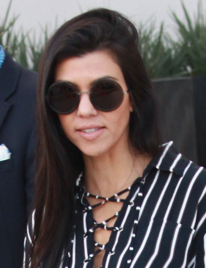 Kourtney Kardashian wore her long dark tresses down