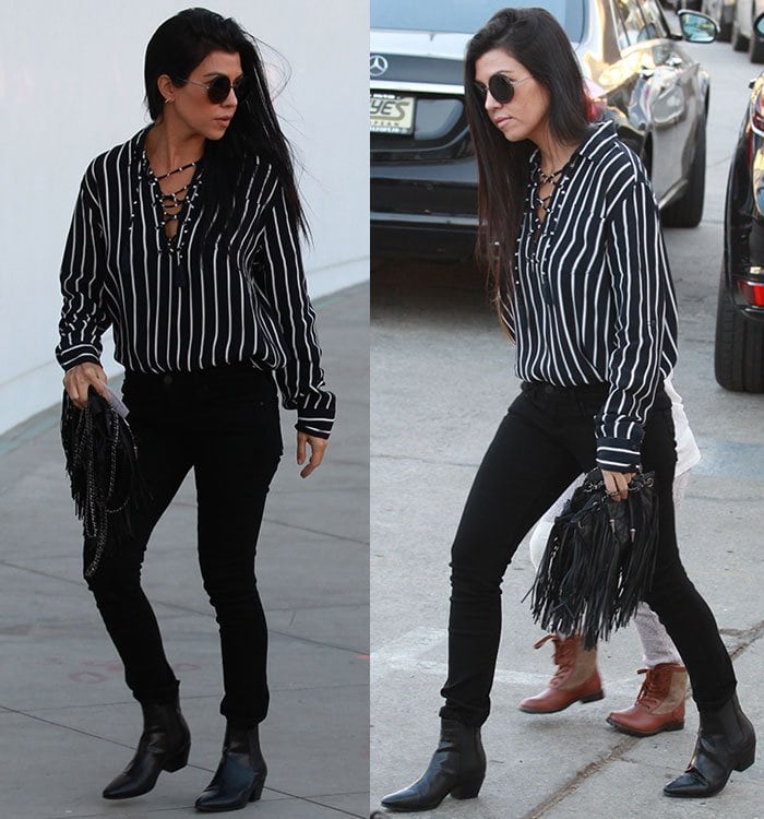 Kourtney Kardashian in a Faithfull the Brand striped top and black jeans