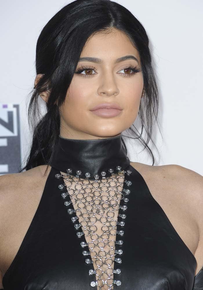 Kylie Jenner exudes elegance with a soft, neutral makeup look and a chic, loose updo
