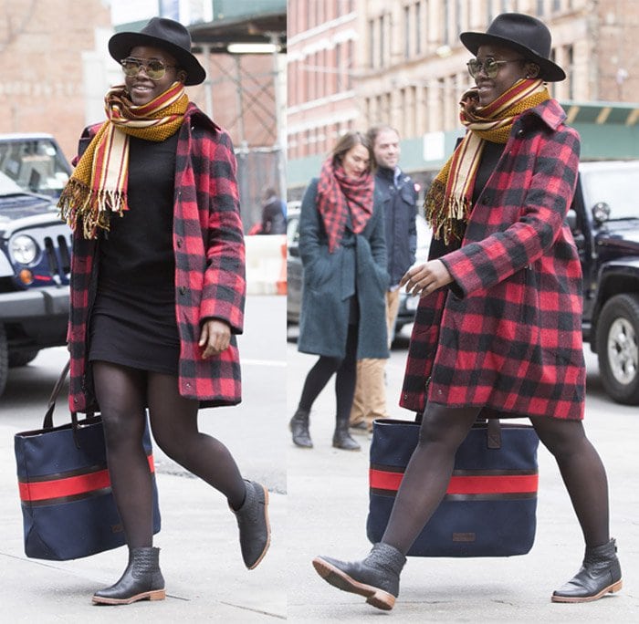 Lupita Nyong’o wears a Woolrich wool blend plaid coat with sheer tights