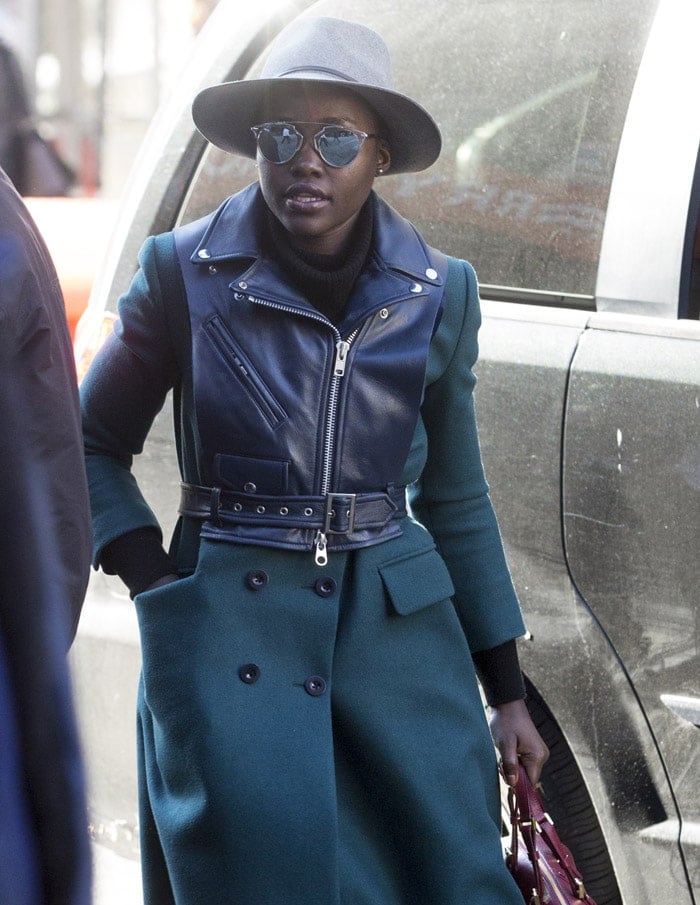 Lupita Nyong’o arrives in a green double-breasted coat at the Public Theater for the matinee of 'Eclipsed'