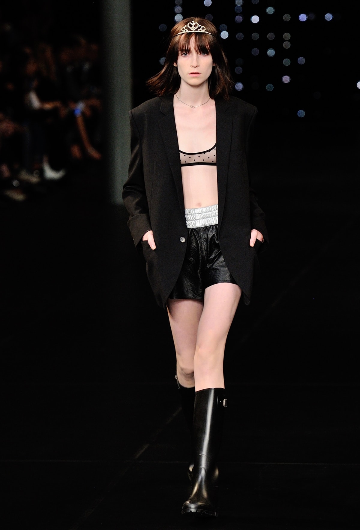 A model walks the runway with a tiara during the Saint Laurent Ready to Wear show