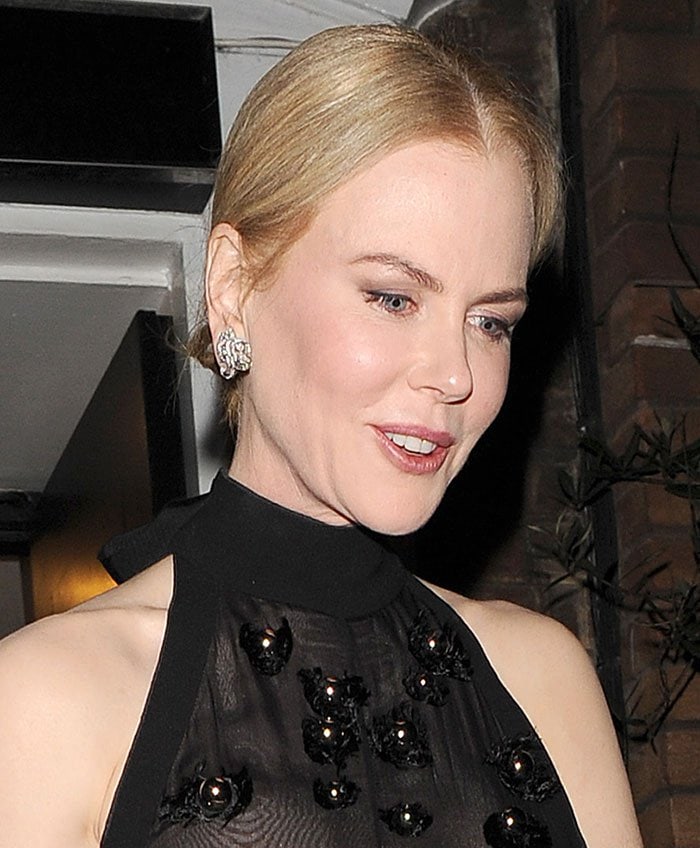 Nicole Kidman wears her blonde hair back as she leaves Claridge's following her Women's Harper Bizarre Award win