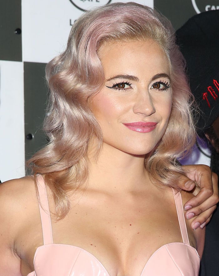 Pixie Lott wears her pink hair down at Hard Rock Cafe in London