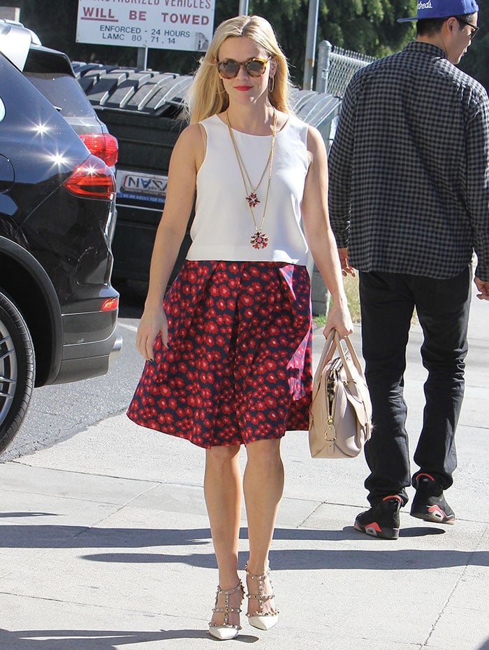 Reese Witherspoon wears her blonde hair down for a shopping trip and a business meeting