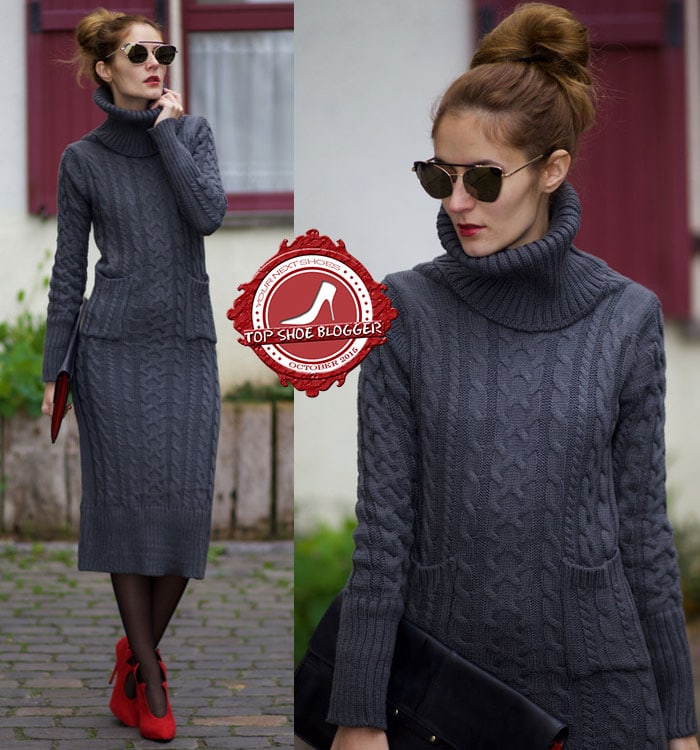 Ruxandra wore red lipstick and a dark gray jacquard turtleneck dress