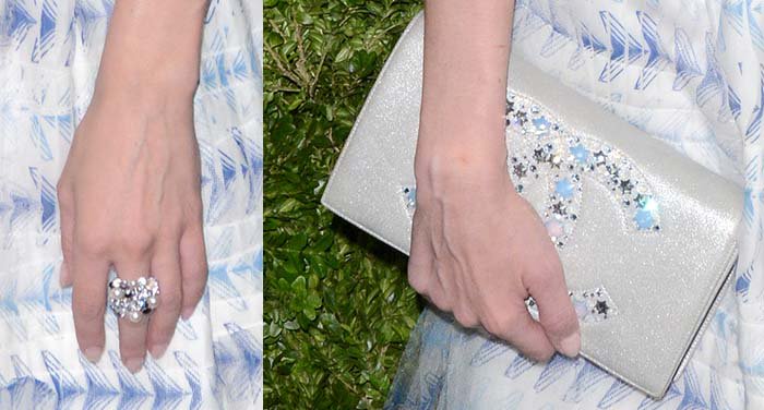 Diane Kruger holds a Chanel clutch