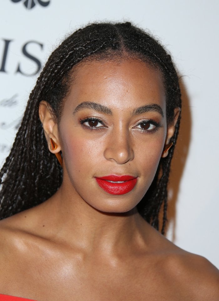 Solange Knowles showcased her stunning new long braids that cascaded all the way down to her waist and her outfit was complemented by a striking orange-red lipstick