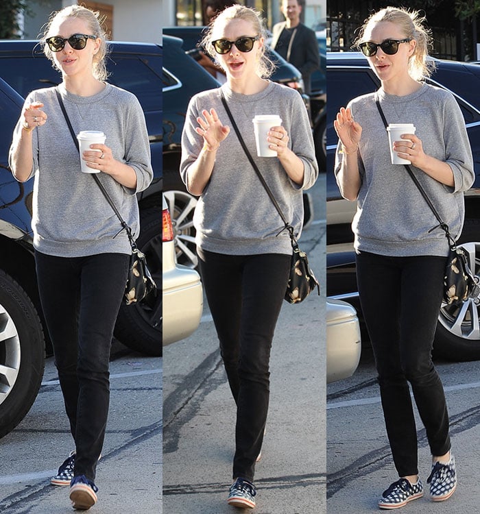 Amanda Seyfried wears a gray sweatshirt and Ksubi black jeans while leaving breakfast