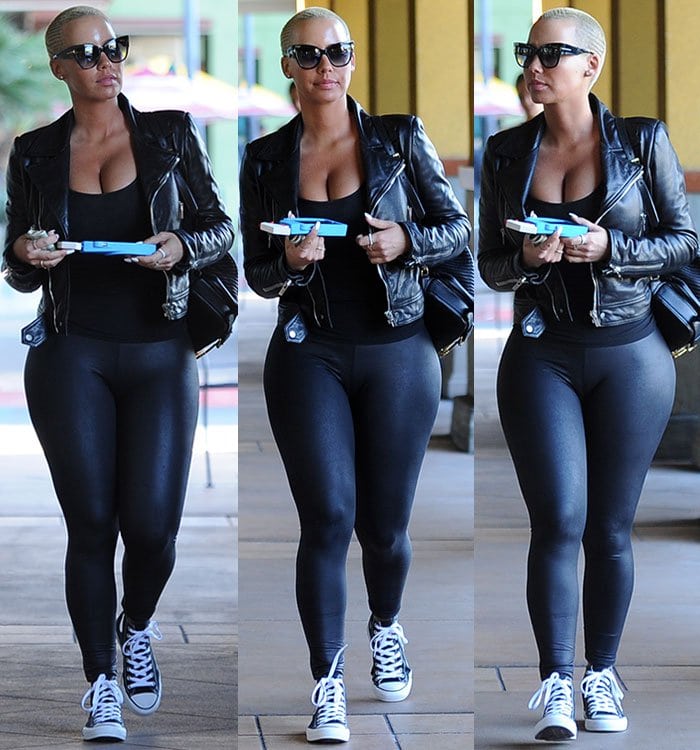 Amber Rose wears skin tight leggings, a low-cut tank top and a leather jacket out in Studio City