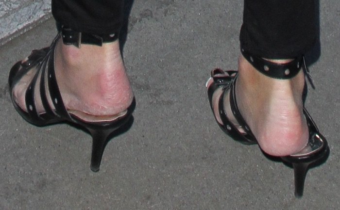 Caitlyn Jenner steps out in strappy black kitten heels, though her dry heels might be calling for some extra care