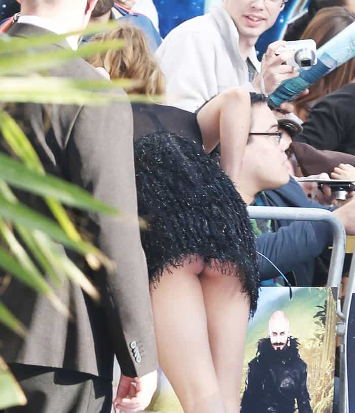 Cara Delevingne should know better than to bend over in a mini dress