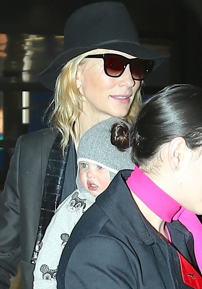 Cate Blanchett covers her hair with a hat as she arrives at Los Angeles Airport with Edith Vivian Patricia Upton