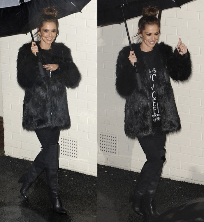Cheryl Fernandez Versini styled her black fur coat with skinny jeans and boots