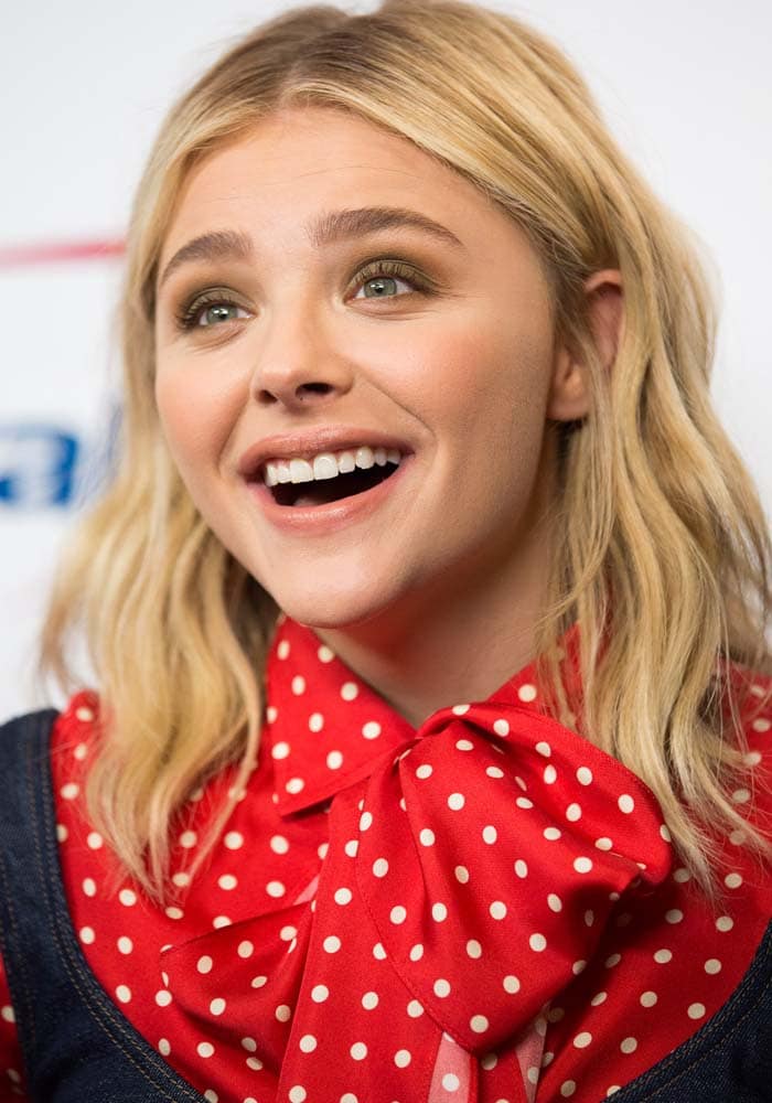 Chloë Grace Moretz wears a Saint Laurent blouse on the red carpet