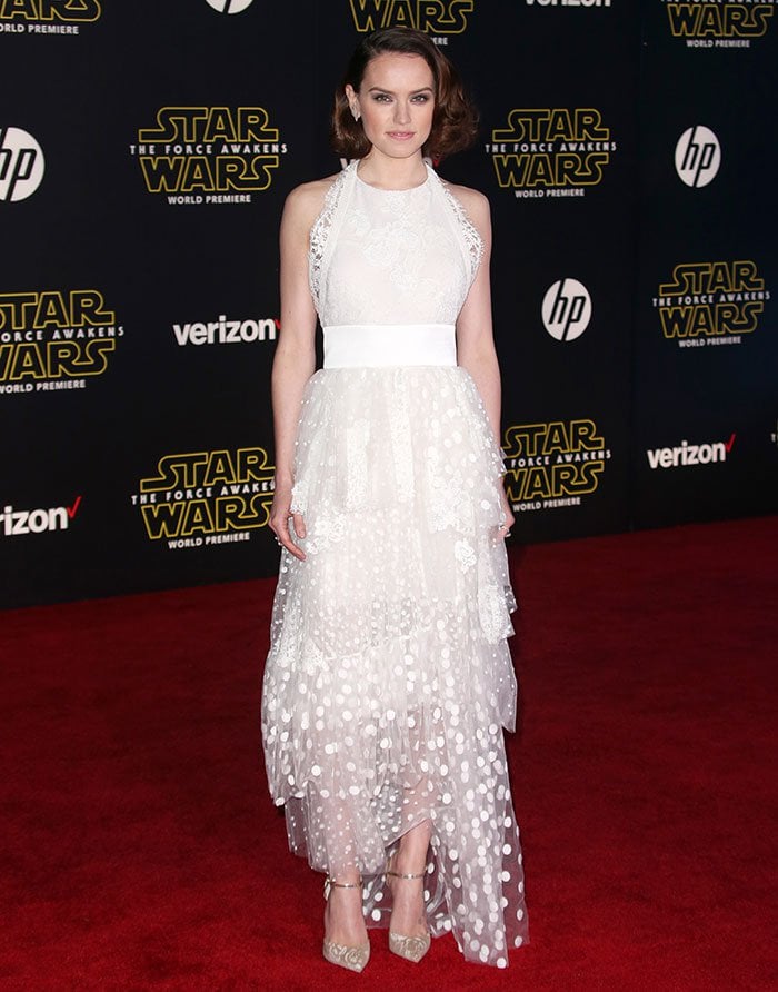 Daisy Ridley's halter dress features a cinched waist, a tiered polka dot tulle skirt, and a Chantilly lace bodice