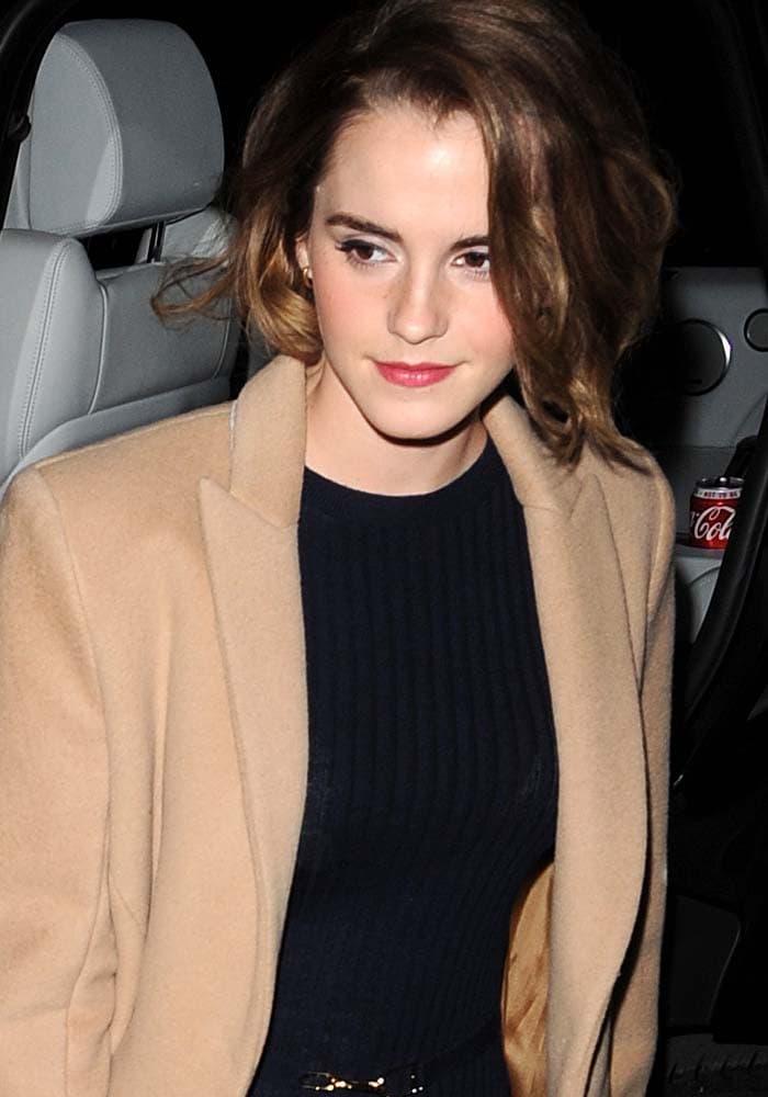 Emma Watson shows off her new short hair as she attends the film screening of "The True Cost"