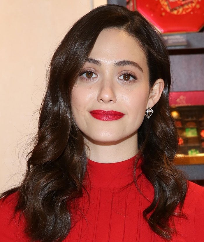 Emmy Rossum wears a pair of geometric earrings from Noor Fares