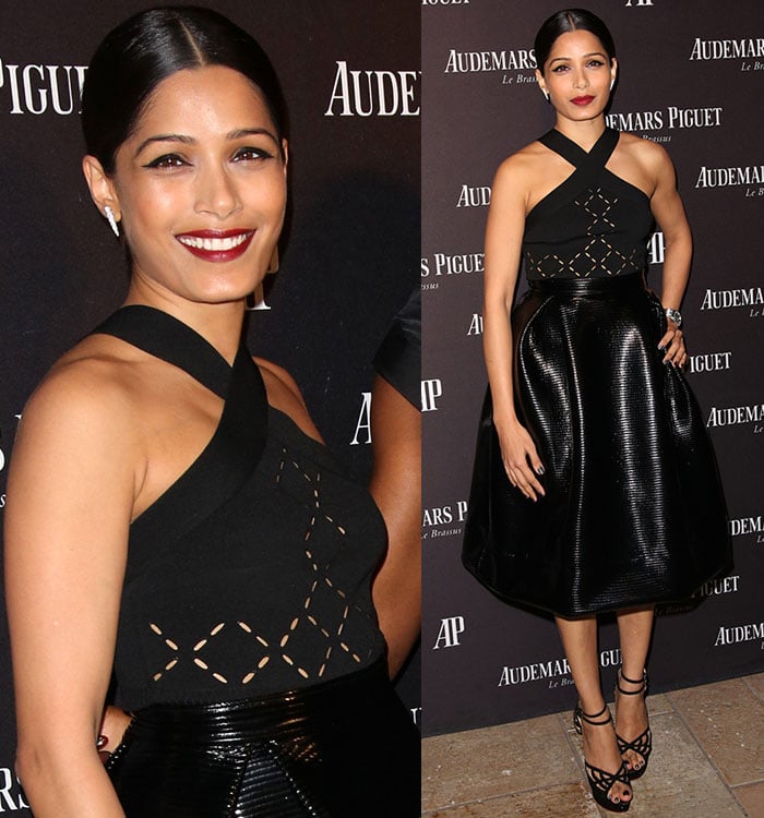 Freida Pinto wears bright red lipstick as she poses for photos in Cushnie Et Ochs