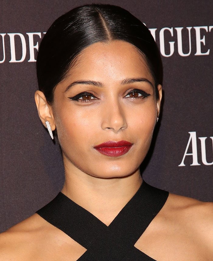 Freida Pinto wears her hair back at the opening of Audemars Piguet Rodeo Drive