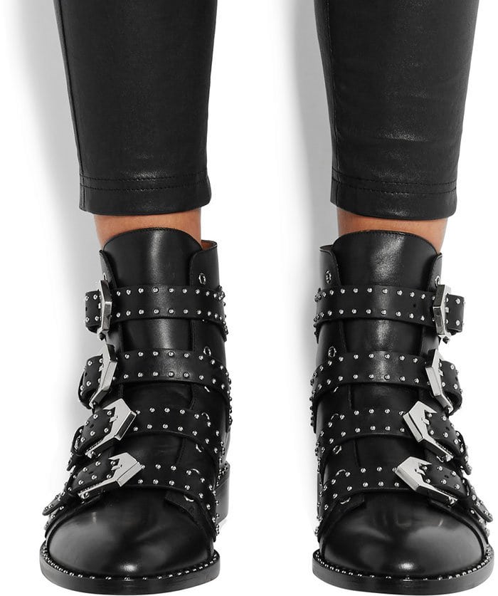 These black ankle boots have a flattering almond toe and are punctuated with flawlessly applied silver studs