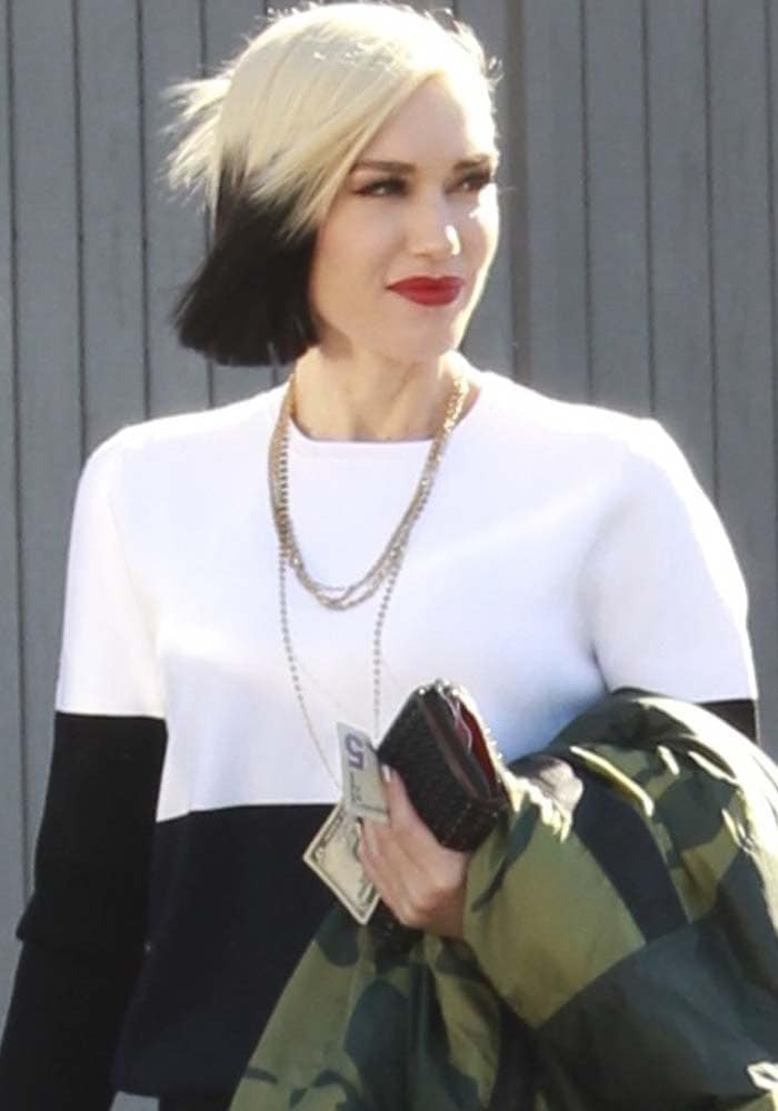 Gwen Stefani carrying Christian Louboutin's Panettone spiked calfskin wallet