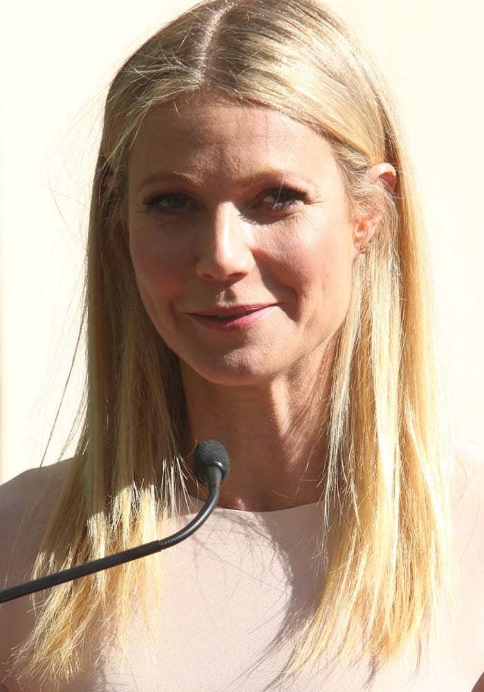 Gwyneth Paltrow wears her blonde hair down as she supports friend Rob Lowe at the Hollywood Walk of Fame