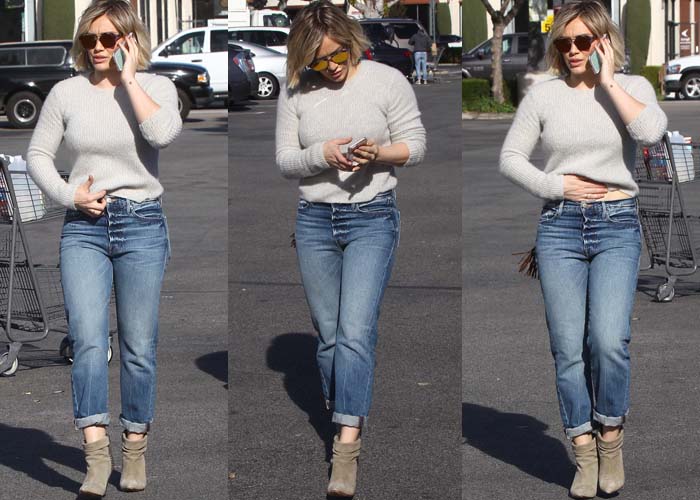 Hilary Duff wears a cropped sweater and high-waisted jeans while out on a grocery run