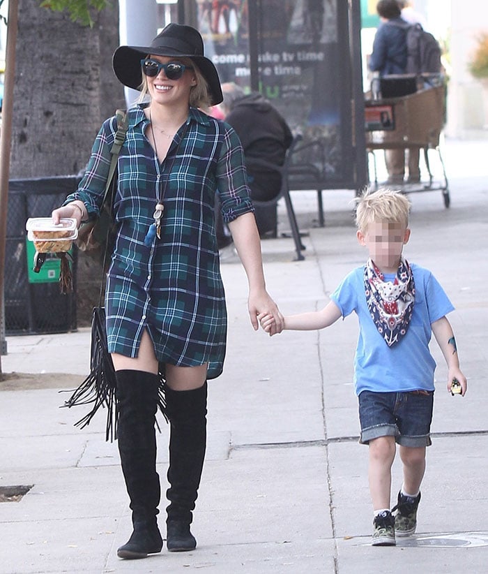 Hilary Duff covers her hair with a trendy hat while out in Studio City with her son Luca