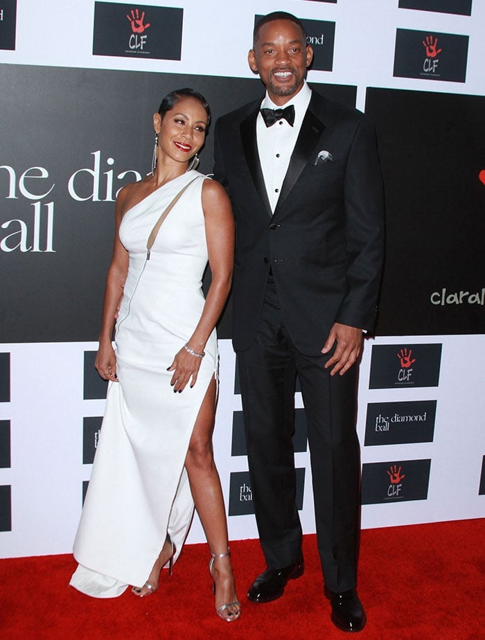 Jada Pinkett Smith and Will Smith pose for photos together on the red carpet