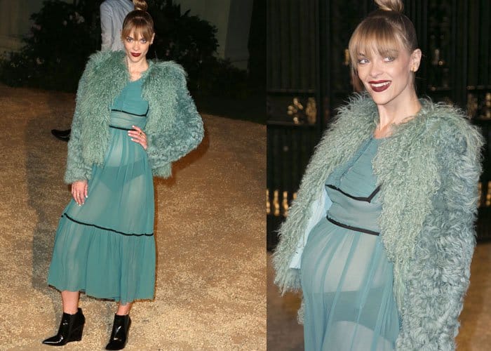 Actress Jaime King showcases her baby bump in a seafoam green gown under a shaggy coat
