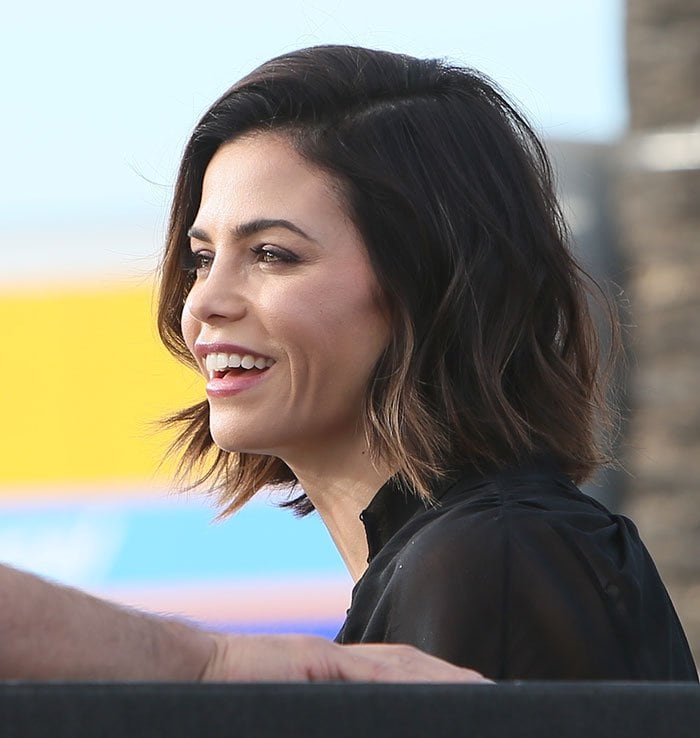 Jenna Dewan-Tatum smiles broadly as she arrives on the set of "Extra"