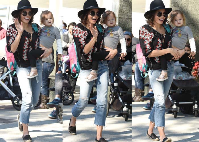 Jenna Dewan-Tatum carries her daughter, Everly Elizabeth Maiselle Tatum, during an outing to Studio City Farmers Market