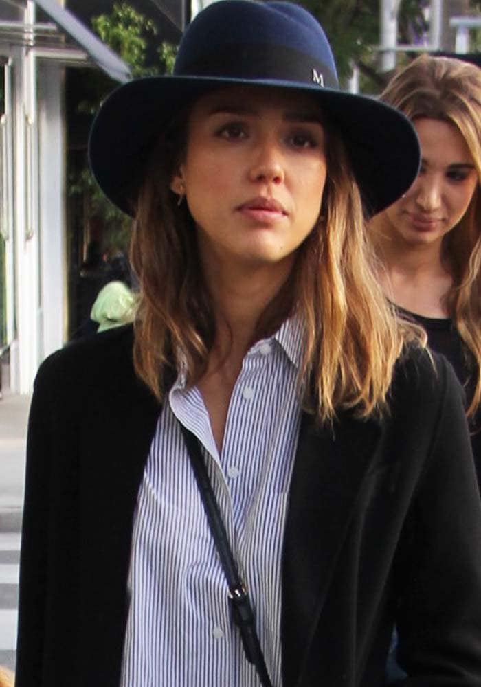 Jessica Alba covers her hair with a hat during a shopping outing in Beverly Hills