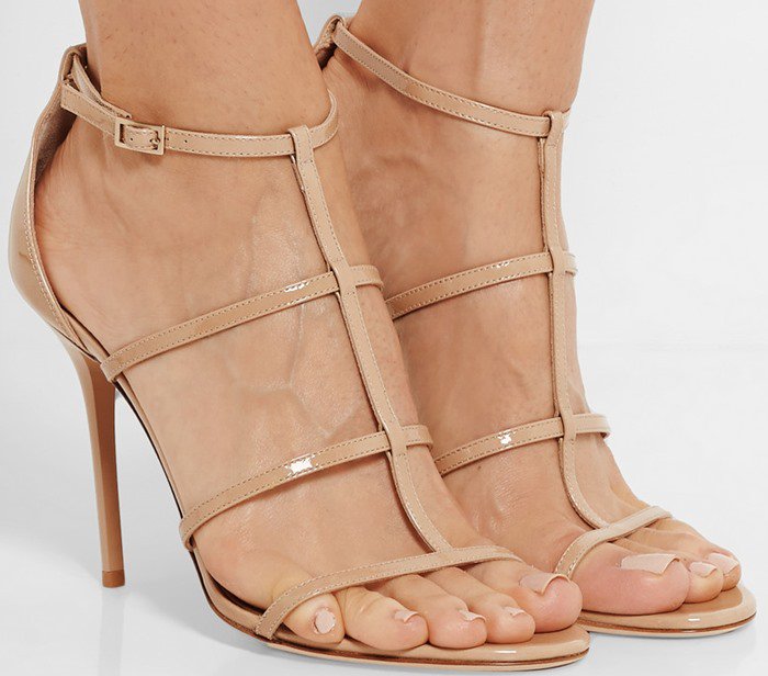 Jimmy Choo's signature 'Dory' sandals have been crafted in Italy from beige patent-leather