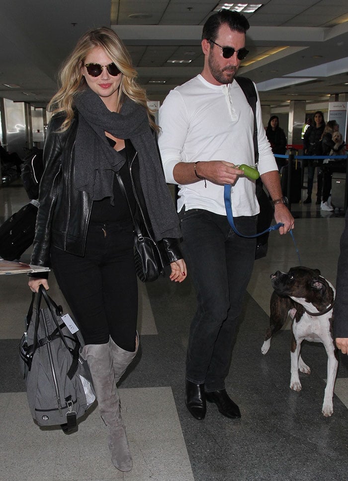 Kate Upton, boyfriend Justin Verlander, and Harley the Boxer stroll through LAX together