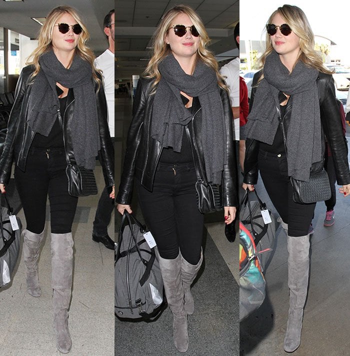 Kate Upton carries a Lululemon travel bag through the Los Angeles airport