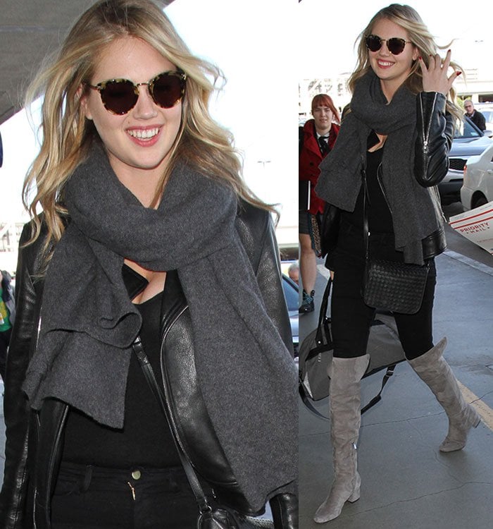 Kate Upton wears sunglasses and a gray scarf as she strolls through LAX