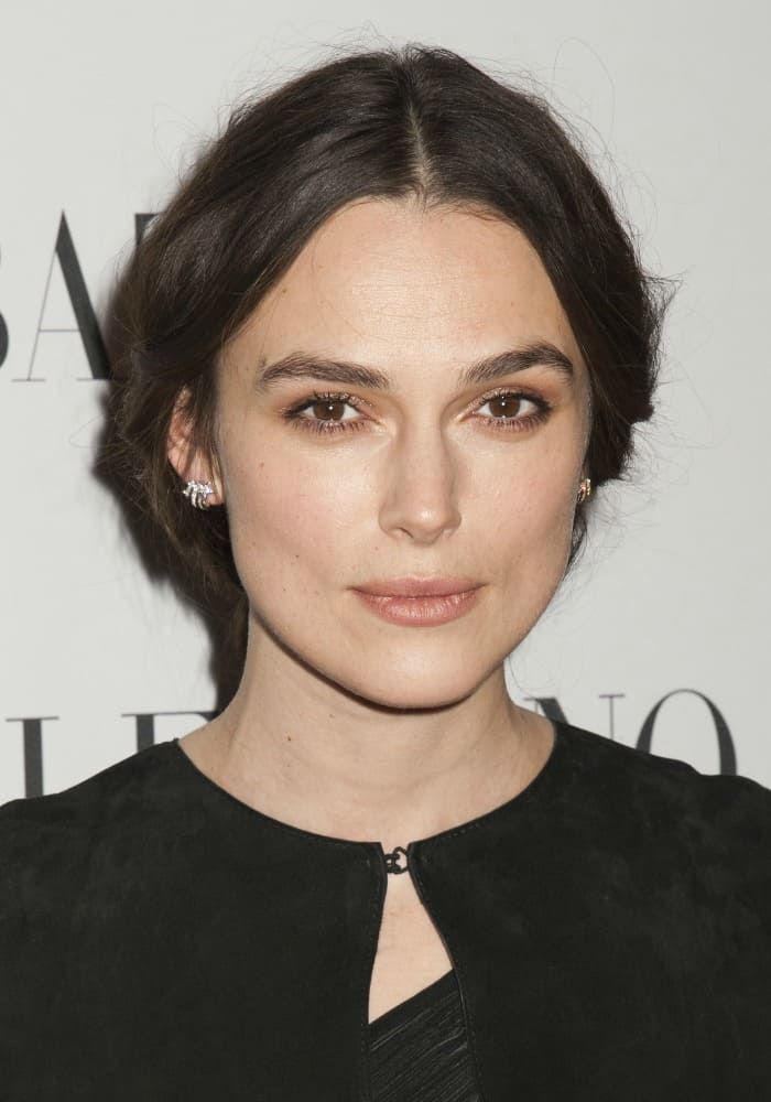 Flawlessly applied tones of muted makeup accentuated Keira Knightley's striking facial features, while her brunette locks were swept up into an elegant bun