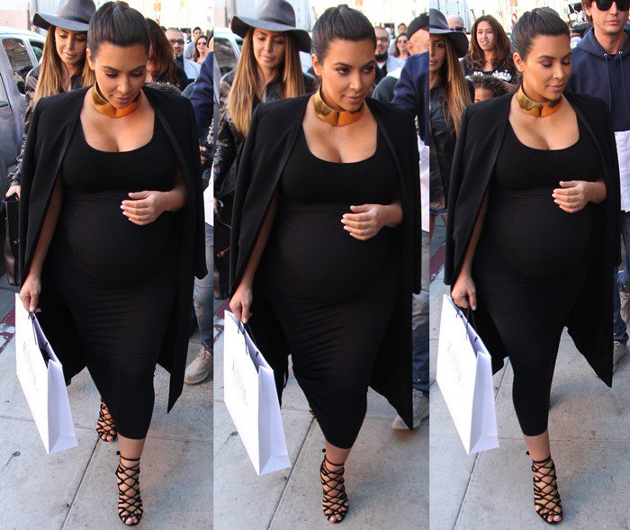A very pregnant Kim Kardashian wears a pair of Hermes cage sandals while shopping in Beverly Hills