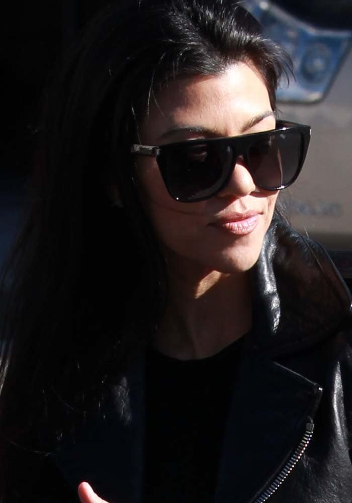 Kourtney Kardashian accessorized her look with sunglasses from Saint Laurent